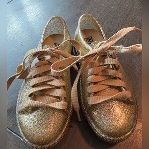 Mel Dreamed by Melissa Mel Be Gold Glitter jelly lace-up sneakers, GUC 11T